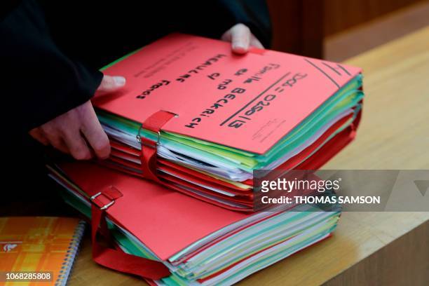 Files for the Beckrich family are seen ahead of an appeal trial of serial killer Francis Heaulme at the courthouse in Versailles, southwest of Paris...