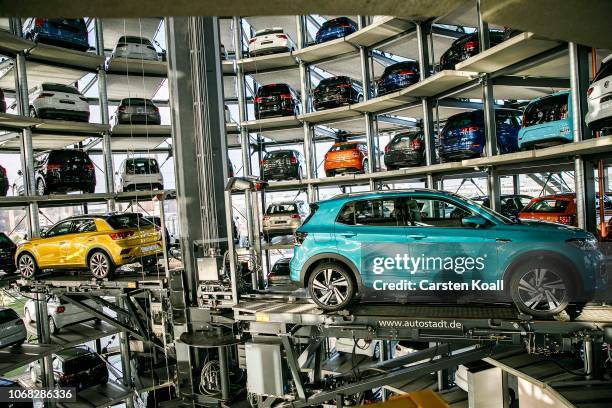 Volkswagen T-Cross and a Volkswagen t-Roc are presented in one of the twin car towers at the Volkswagen Autostadt visitors center on December 4, 2018...