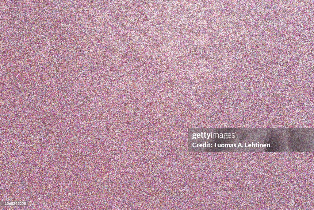 Colorful glitter full frame textured shiny abstract background.