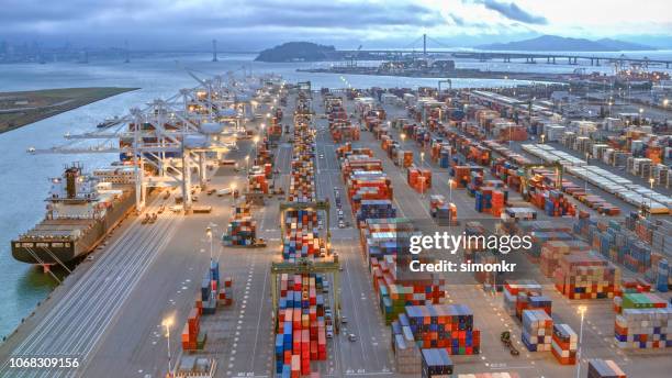 aerial view of large shipping docks in harbour, oakland, california - oakland california stock pictures, royalty-free photos & images