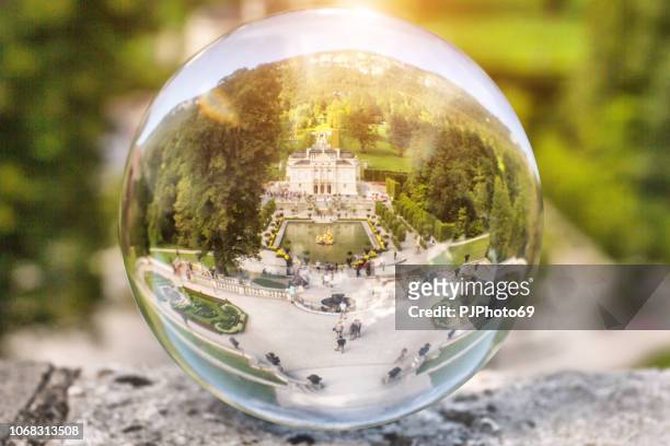 the linderhof castle through a lensball - oberammergau stock pictures, royalty-free photos & images
