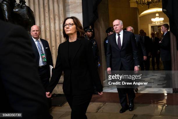 Director Gina Haspel and former CIA Director John Brennan pay their arrive to pay their respects at the casket of the late former President George...