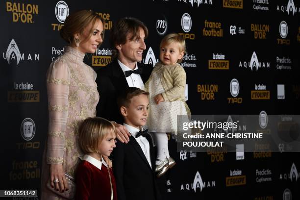 Real Madrid's Croatian midfielder Luka Modric , his wife Vanja Bosnic , Ema , Ivano and Sofia pose upon arrival at the 2018 Ballon d'Or award...
