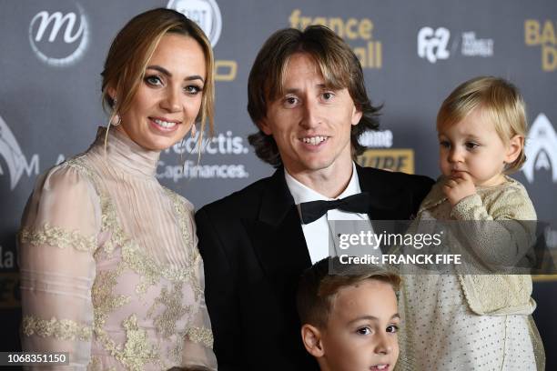 Real Madrid's Croatian midfielder Luka Modric , his wife Vanja Bosnic , Ivano and Sofia pose upon arrival at the 2018 Ballon d'Or award ceremony at...