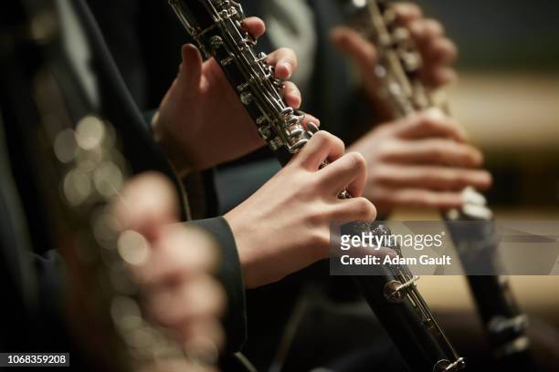 girls playing clarinet - klarinette stock-fotos und bilder