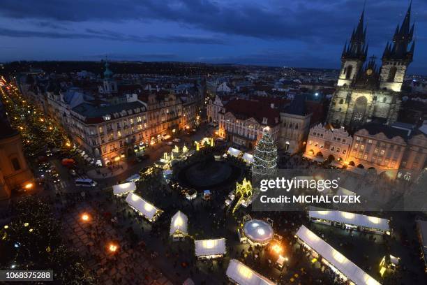 The Christmas market with the illuminated Christmas tree is pictured at the Old Town Square on December 04, 2018 in Prague.
