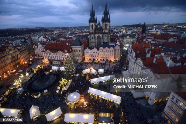 The Christmas market with the illuminated Christmas tree at the Old Town Square is pictured on December 04, 2018 in Prague.
