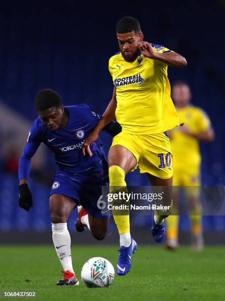 Tariq Lamptey of Chelsea battles for posession with Jake Jervis of AFC Wimbledon during the Checkatrade Trophy second round match between Chelsea U21...