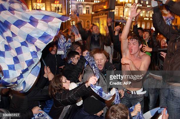 Fans of Zenit St. Petersburg celebrate their team's victory in Russia's Premier league football championship match in St.Petersburg on November 14,...