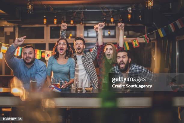 fans at the bar - bar girl stock pictures, royalty-free photos & images