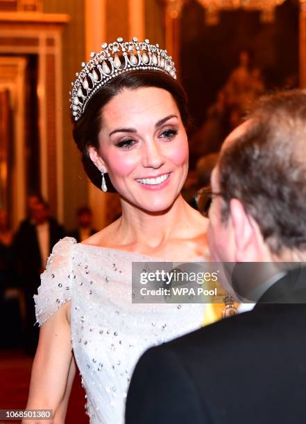 Catherine, Duchess of Cambridge greets guests at an evening reception for members of the Diplomatic Corps at Buckingham Palace on December 04, 2018...