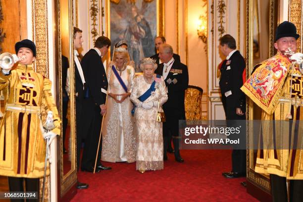 Queen Elizabeth II and Camilla, Duchess of Cornwall greet guests at an evening reception for members of the Diplomatic Corps at Buckingham Palace on...