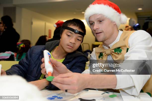 Boston Celtics mascot Lucky visits with Bo at Boston Children's Hospital December 4, 2018 in Boston, Massachusetts.