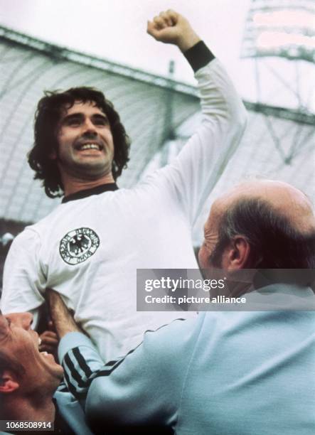 Celebrating German international football player Gerd Mueller is lifting his clenched fist after the final. On the right hand side German team coach...