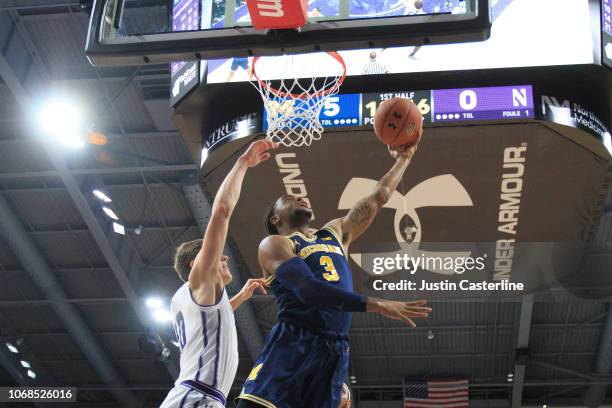 Zavier Simpson of the Northwestern Wildcats drives to the basket during the first half in the game against the Northwestern Wildcats at Welsh-Ryan...