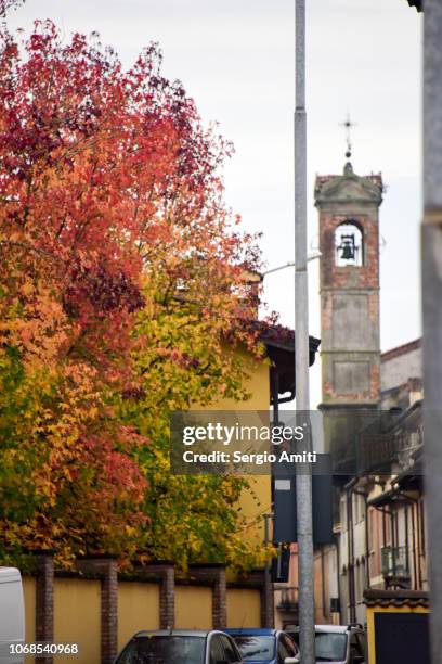 church bell tower and autumn trees - lodi lombardy stock pictures, royalty-free photos & images