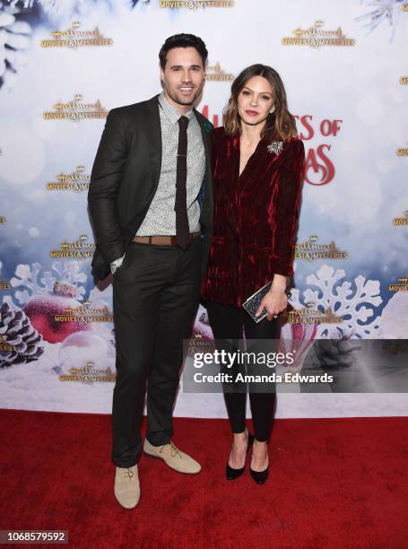 Actor Brett Dalton and actress Aimee Teegarden arrive at the Hallmark Channel "Once Upon A Christmas Miracle" screening and holiday party at 189 by...