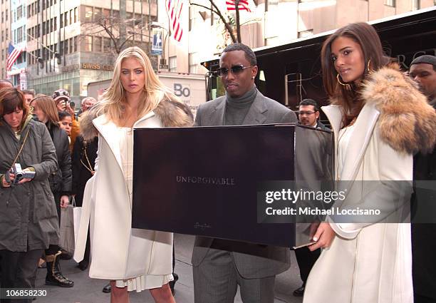 Sean "Diddy" Combs" and his "Unforgivable" Girls during Sean "Diddy" Combs Hand Delivers the First Limited Edition Couture Bottle of His New...