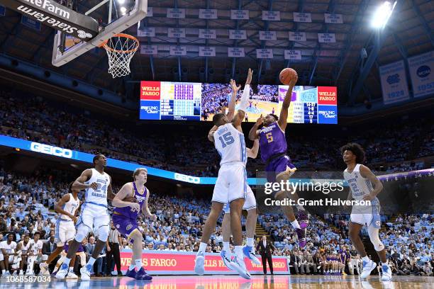 Johnnie Vassar of the Tennessee Tech Golden Eagles drives againsgt Garrison Brooks of the North Carolina Tar Heels during the first half of their...