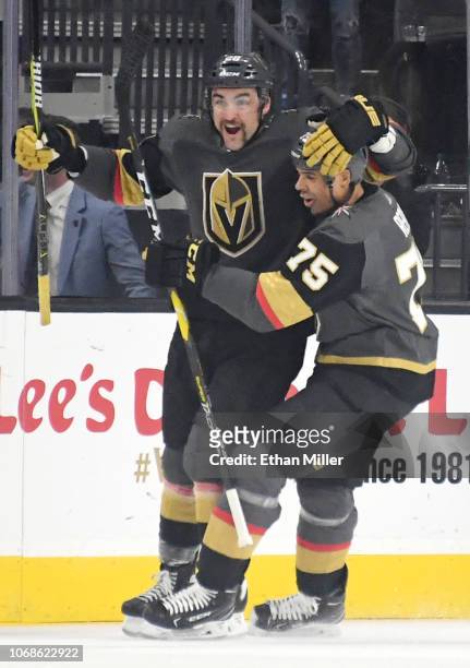William Carrier and Ryan Reaves of the Vegas Golden Knights celebrate after Carrier scored a first-period goal against the St. Louis Blues during...