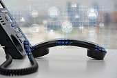 IP Phone double exposure with blue LED world map and business icon of VOIP human and  for communication concept