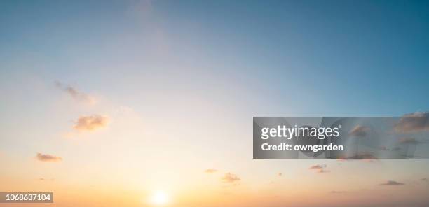 the rosy clouds at sunrise - soleggiato foto e immagini stock