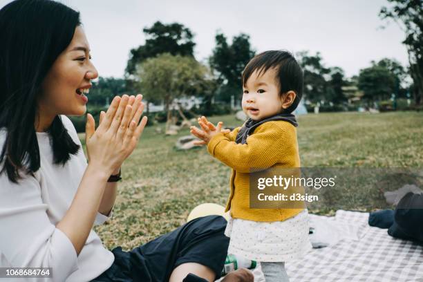Clapping Mother Mom Clapping With Baby Photos and Premium High Res Pictures - Getty Images