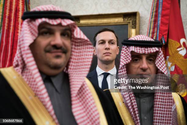 White House senior adviser Jared Kushner stands among Saudi officials as President Donald Trump talks with Crown Prince Mohammad bin Salman of the...