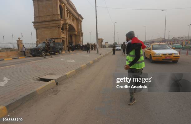 Security forces intervene in protesters wearing yellow vests during a protest against lack of public service and unemployment in Basra, Iraq on...