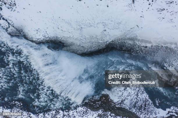 scenic aerial view of dettifoss waterfall in winter - myvatn stock pictures, royalty-free photos & images