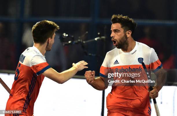 Valentin Verga and Glenn Schuurman of Netherlands celebrate a goal during the FIH Men's Hockey World Cup Group D match between Germany and...