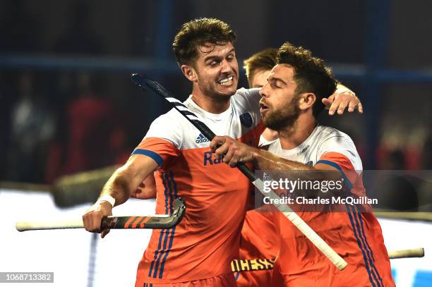 Valentin Verga and Glenn Schuurman of Netherlands celebrate a goal during the FIH Men's Hockey World Cup Group D match between Germany and...