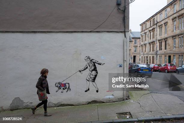 Street art showing Theresa May with a British bulldog on the 2nd November 2018 in Glasgow in the United Kingdom.