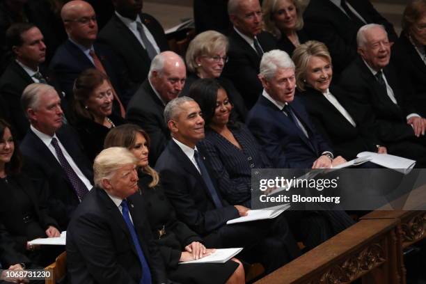 President Donald Trump, first row from left, U.S. First Lady Melania Trump, former U.S. President Barack Obama, former U.S. First Lady Michelle...