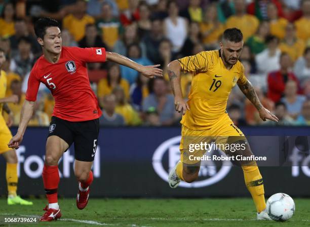 Josh Risdon of Australiais chased by Ju Sejong of Korea Republic during the International Friendly match between the Australian Socceroos and Korea...