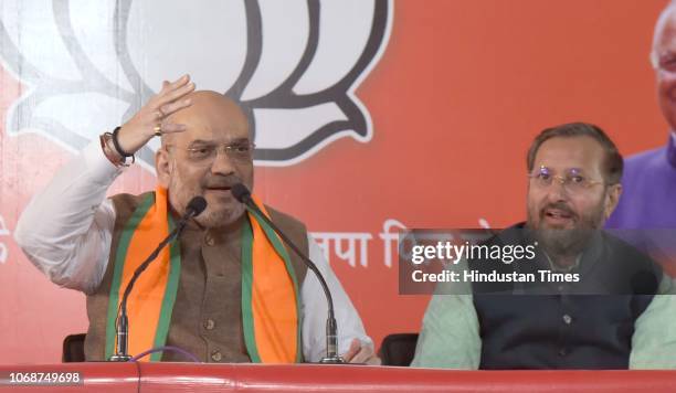 President Amit Shah and Union HRD Minister Prakash Javadekar address the media ahead of the Rajasthan State Assembly elections, at BJP's media...