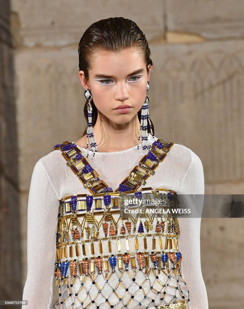 A model walks the runway during the Chanel Metiers D'Art 2018/19