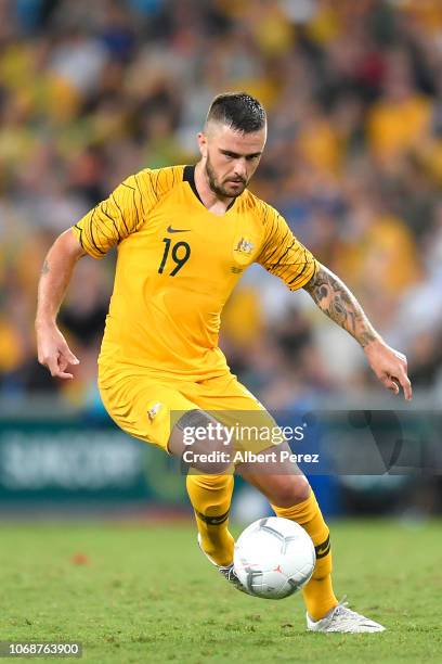 Josh Risdon of Australia dribbles the ball during the International Friendly match between the Australian Socceroos and Korea Republic at Suncorp...