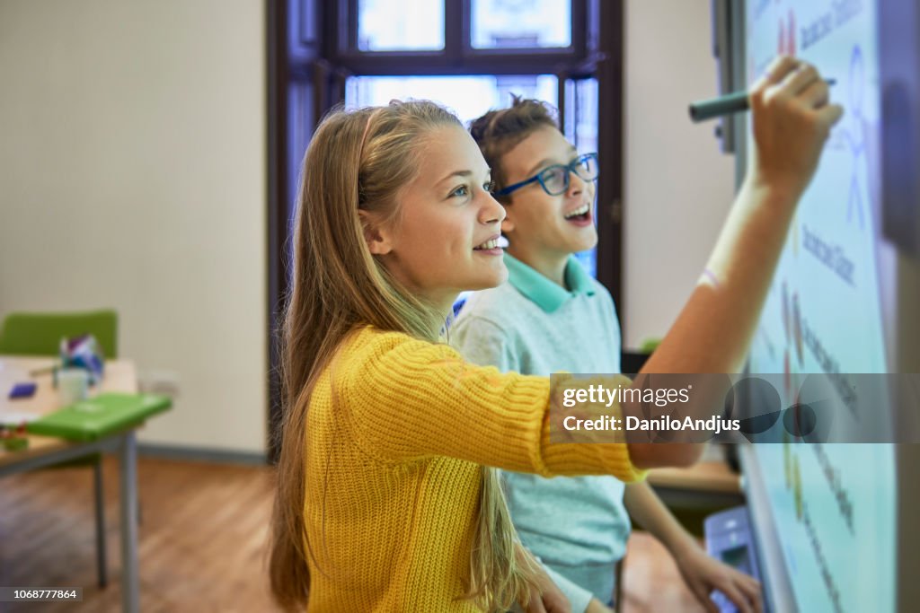 School friends working together on a project