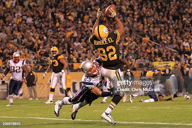 Antwaan Randle El of the Pittsburgh Steelers fumbles a catch in the endzone under pressure from Patrick Chung of the New England Patriots on November...