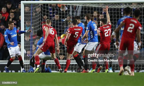 Scott McKenna of Aberdeen scores the opening goal during the Scottish Ladbrokes Premiership match between Rangers and Aberdeen at Ibrox Stadium on...