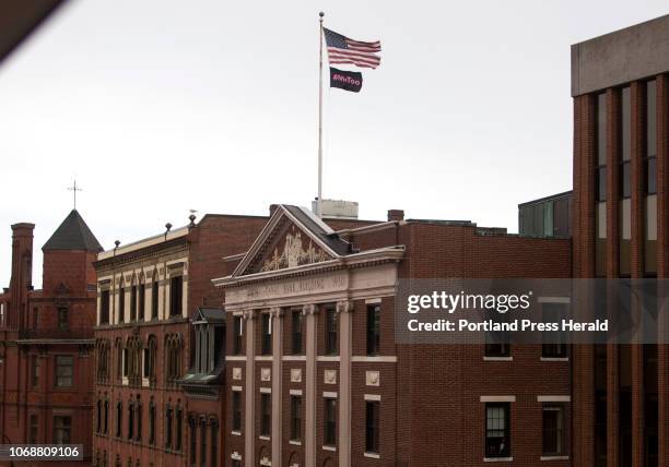 MeToo flag flies below an American flag near Sen. Susan Collins office in Portland on Thursday, November 29, 2018.