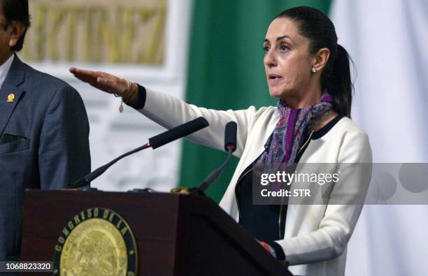 Newly elected Mexico City's Governor Claudia Sheinbaum swears-in during a ceremony at the local Congress in Mexico City on December 05, 2018. -...