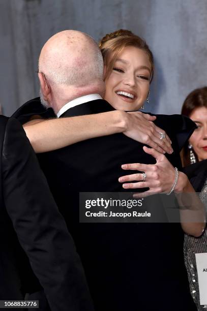 Albert Watson and Gigi Hadid walk the red carpet ahead of the 2019 Pirelli Calendar launch gala at HangarBicocca on December 5, 2018 in Milan, Italy.