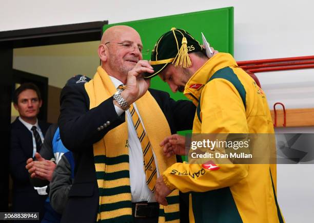 Jake Gordon of Australia is presented with his test debut cap by ARU President Tony Shaw after the international friendly between Italy and Australia...