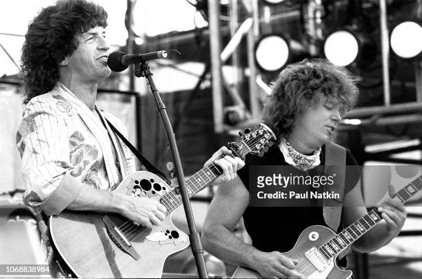 Kevin Cronin and Gary Richrath of REO Speedwagon at Live Aid at Veteran's Stadium in Philadelphia, Pennsylvania, July 13, 1985 .