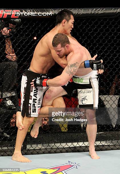 Nate Marquardt of the USA fights with Yushin Okami of Japan during their UFC Middleweight Championship Eliminator bout at the Konig Pilsner Arena on...