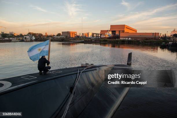 Crew member of submarine ARA San Juan embarks to set sail after complete the mid-life upgrade reparation at Tandanor shypyard on June 02, 2014 in...