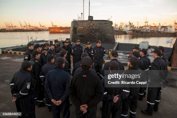 Crew members of submarine ARA San Juan embark for an expedition after the mid-life upgrade reparation at Tandanor shypyard on June 02, 2014 in Buenos...