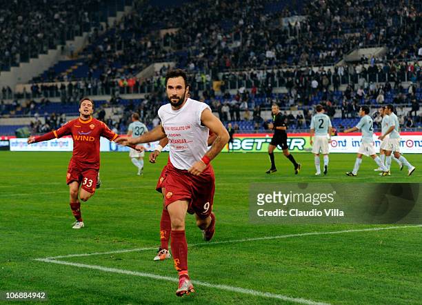 Mirko Vucinic of AS Roma celebrates scoring the second goal during the Serie A match between Lazio and Roma at Stadio Olimpico on November 7, 2010 in...